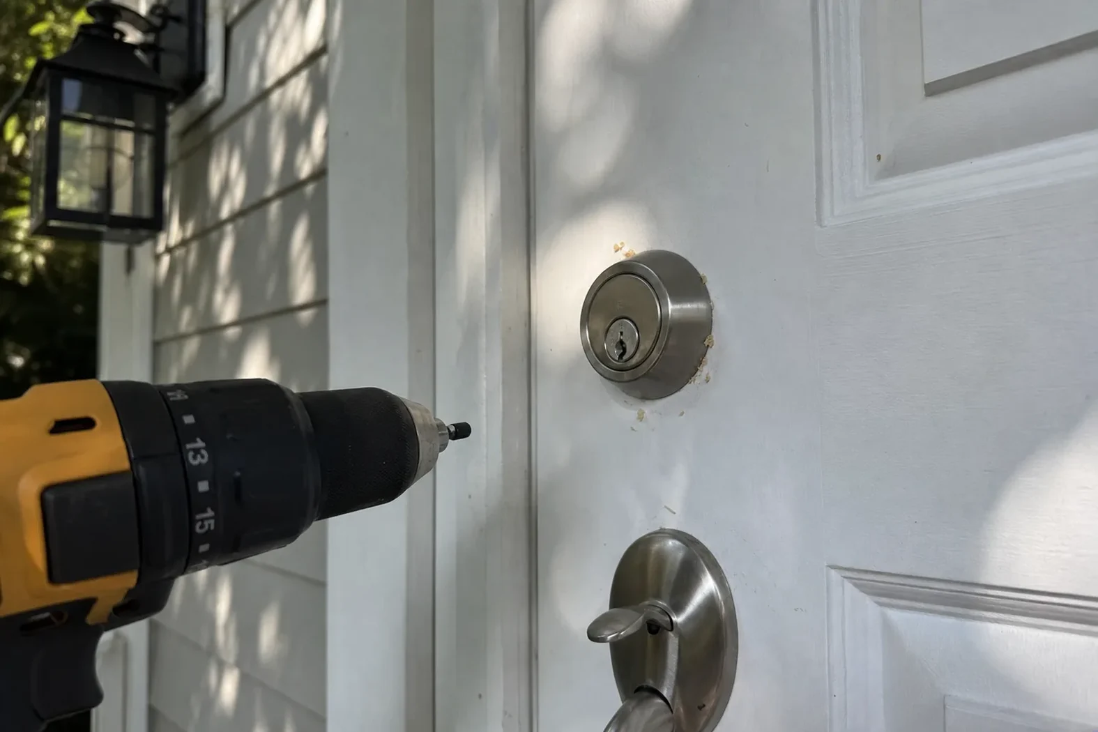 New deadbolt being installed in a front door